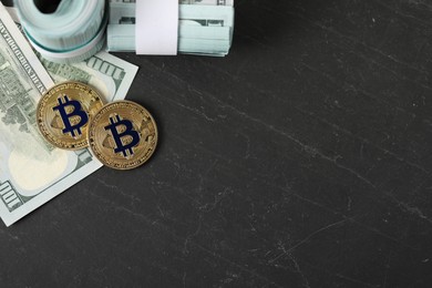 Photo of Cryptocurrency. Bitcoins and dollars on black table, flat lay. Space for text