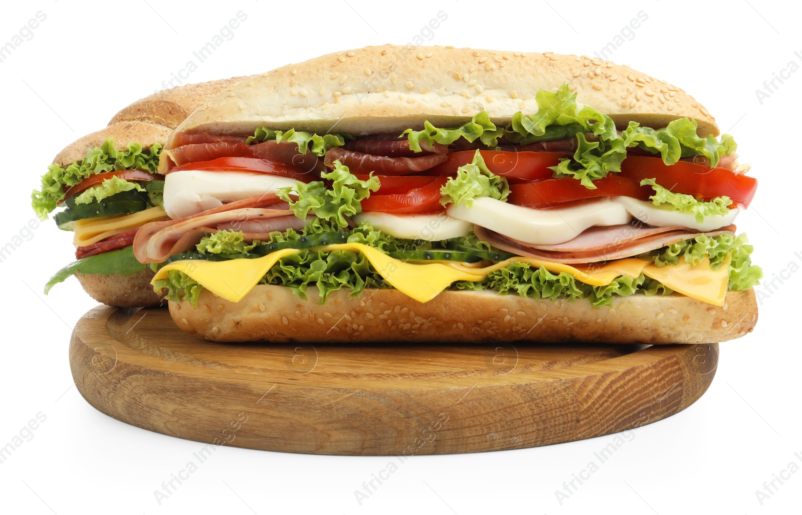 Tasty baguette sandwiches with ham, cheese and vegetables isolated on white Photo of Tasty baguette sandwiches with ham, cheese and vegetables isolated on white