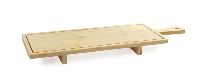 Photo of One wooden serving board with legs isolated on white. Space for text