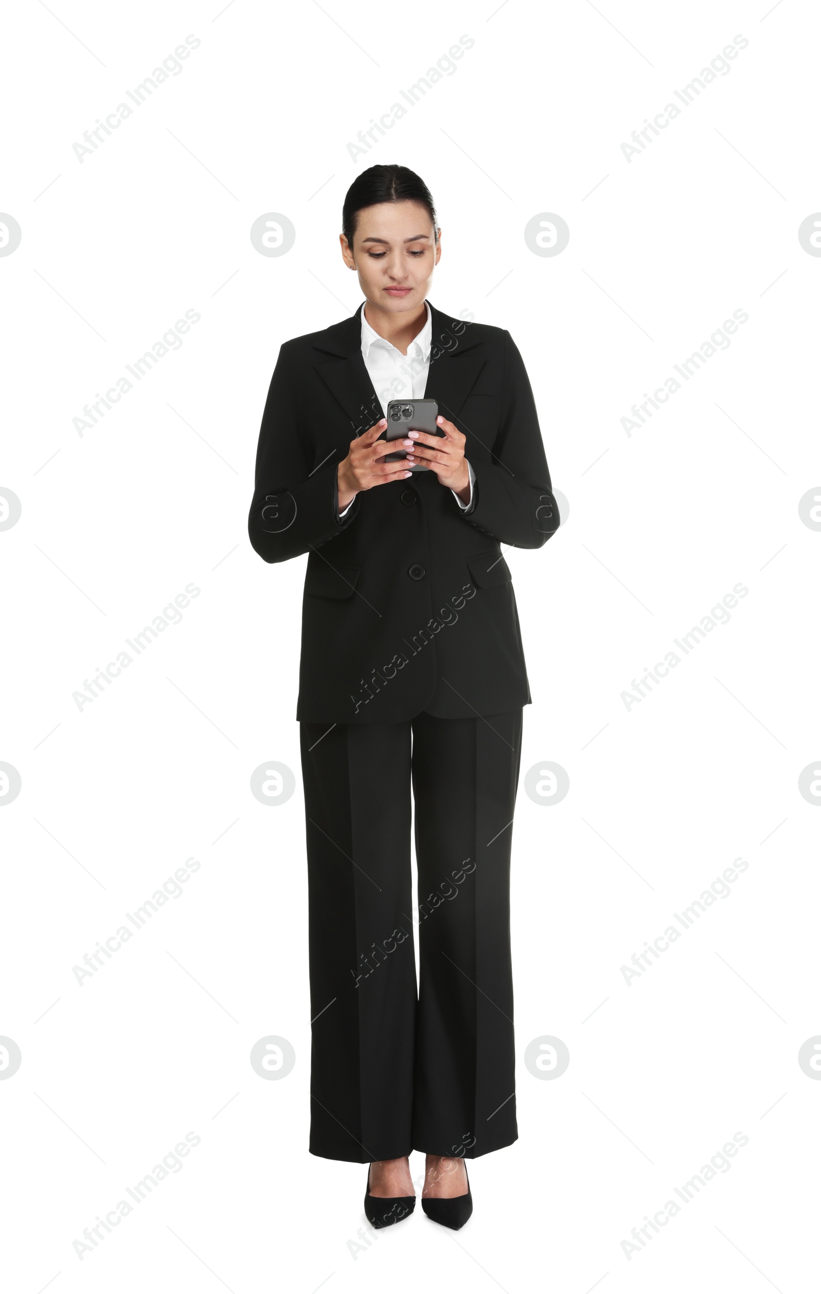 Confident business woman in suit with smartphone on white background Photo of Confident business woman in suit with smartphone on white background