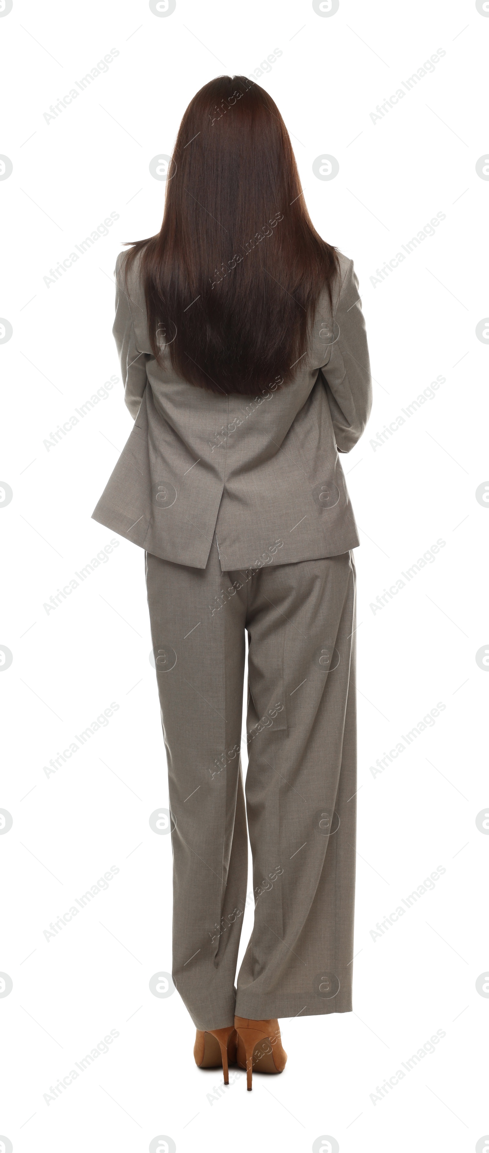 Confident woman in suit on white background, back view Photo of Confident woman in suit on white background, back view