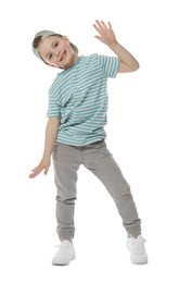 Photo of Happy little boy in baseball hat dancing on white background