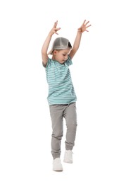 Photo of Cute little boy in baseball hat dancing on white background