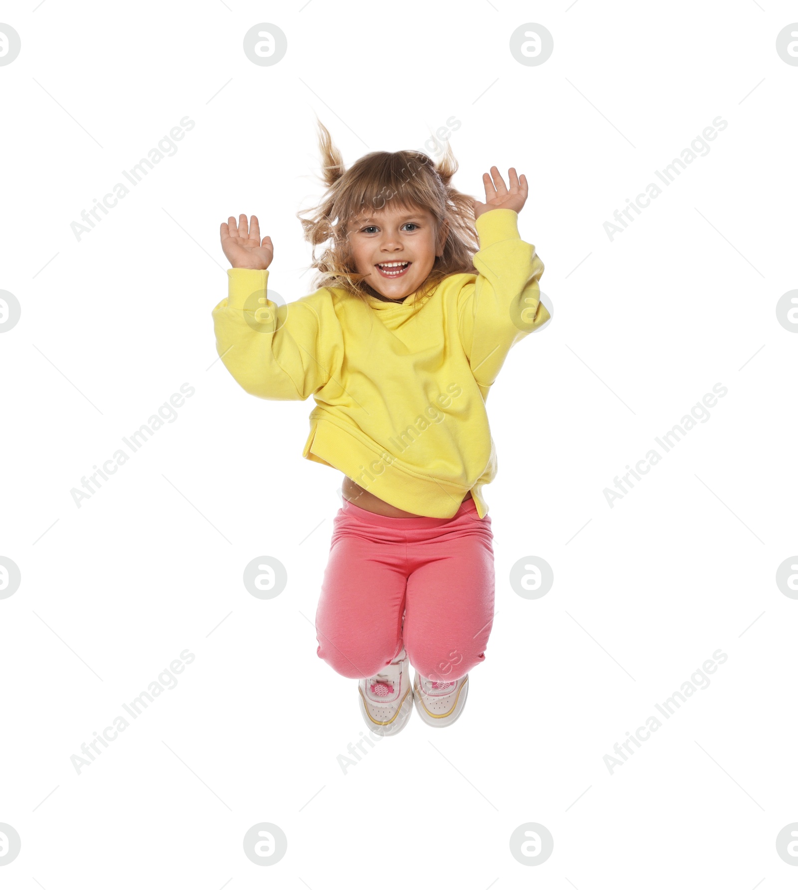 Happy little girl dancing on white background Photo of Happy little girl dancing on white background