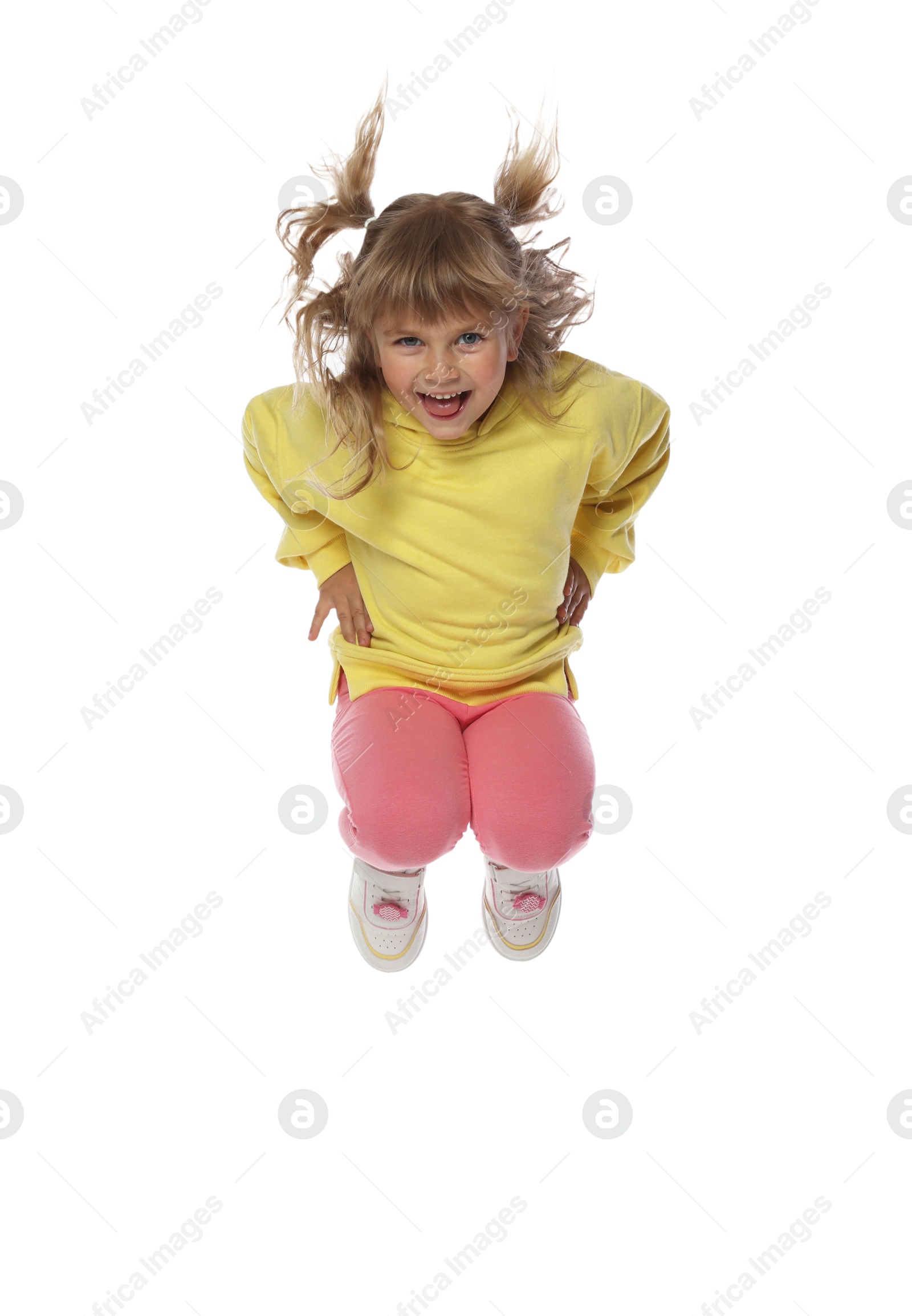 Photo of Happy little girl dancing on white background