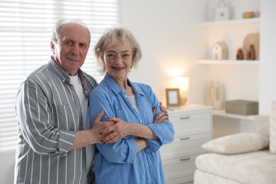 Photo of Lovely senior couple at home, space for text
