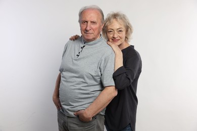 Photo of Portrait of lovely senior couple on white background