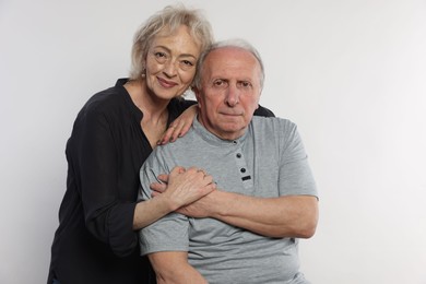 Photo of Portrait of lovely senior couple on white background