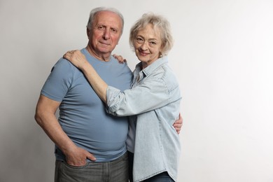 Photo of Portrait of lovely senior couple on white background