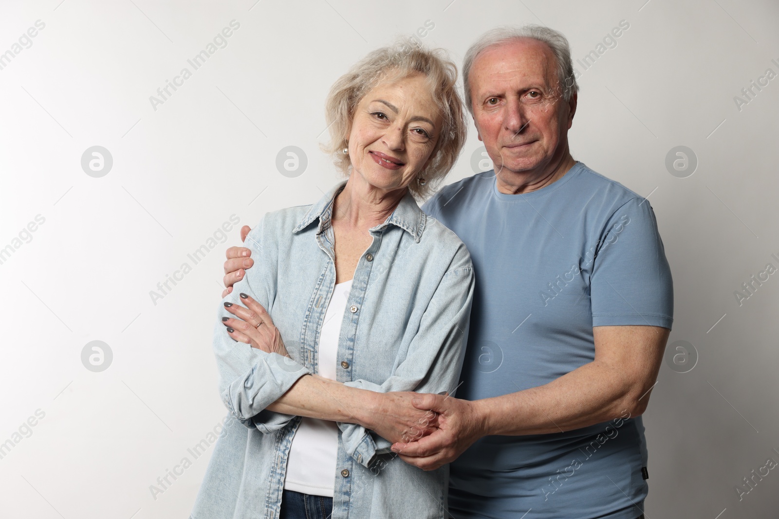 Photo of Portrait of lovely senior couple on white background