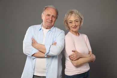 Photo of Portrait of lovely senior couple on grey background