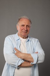 Photo of Portrait of senior man on grey background