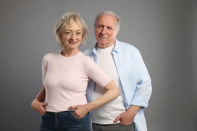 Photo of Portrait of lovely senior couple on grey background