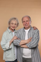 Photo of Portrait of lovely senior couple on beige background