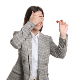 Photo of Targeting. Smiling businesswoman with dart covering eyes on white background