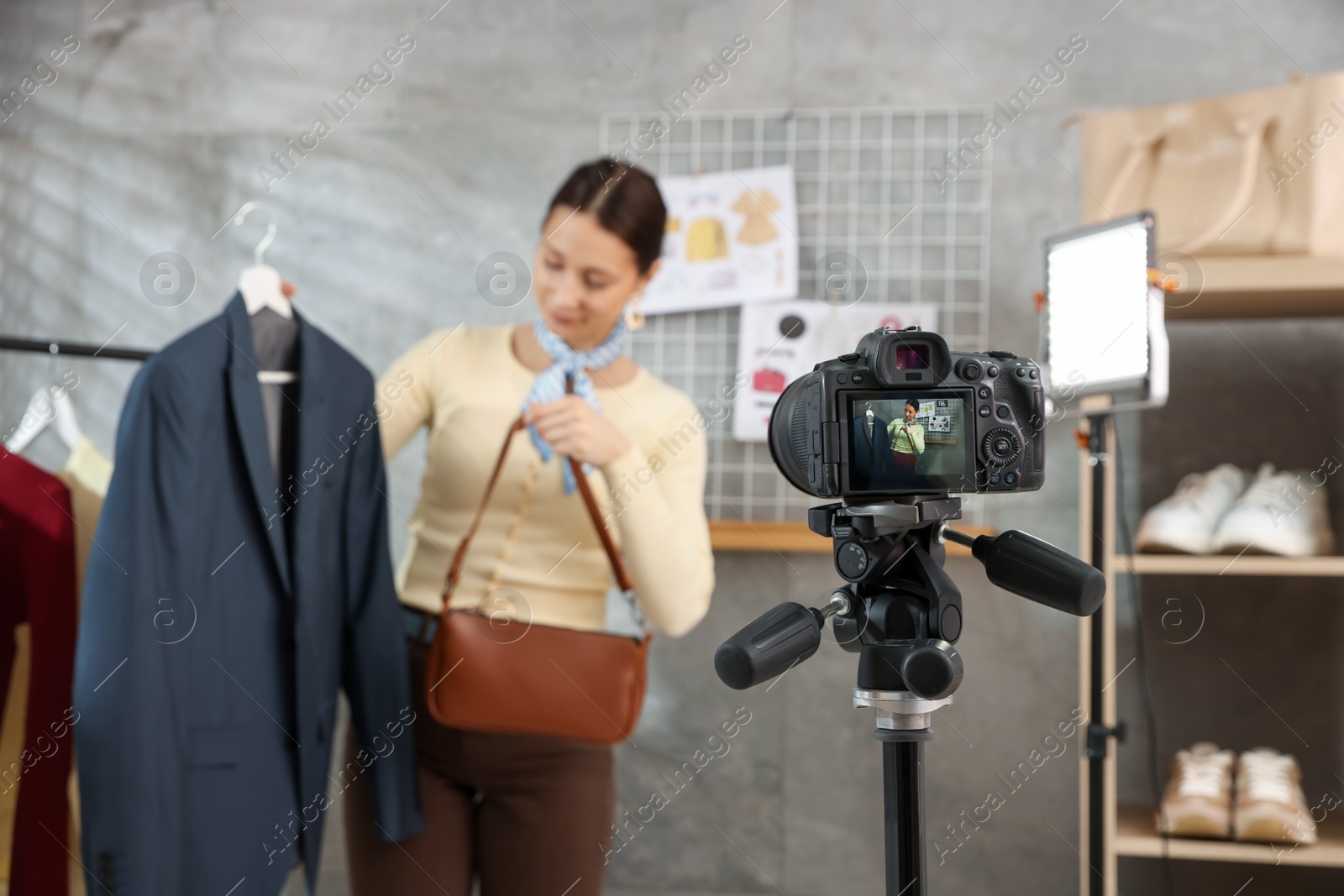 Professional stylist filming video on camera indoors, selective focus Photo of Professional stylist filming video on camera indoors, selective focus