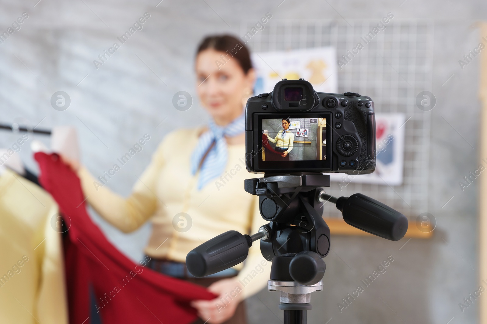 Professional stylist filming video on camera indoors, selective focus Photo of Professional stylist filming video on camera indoors, selective focus