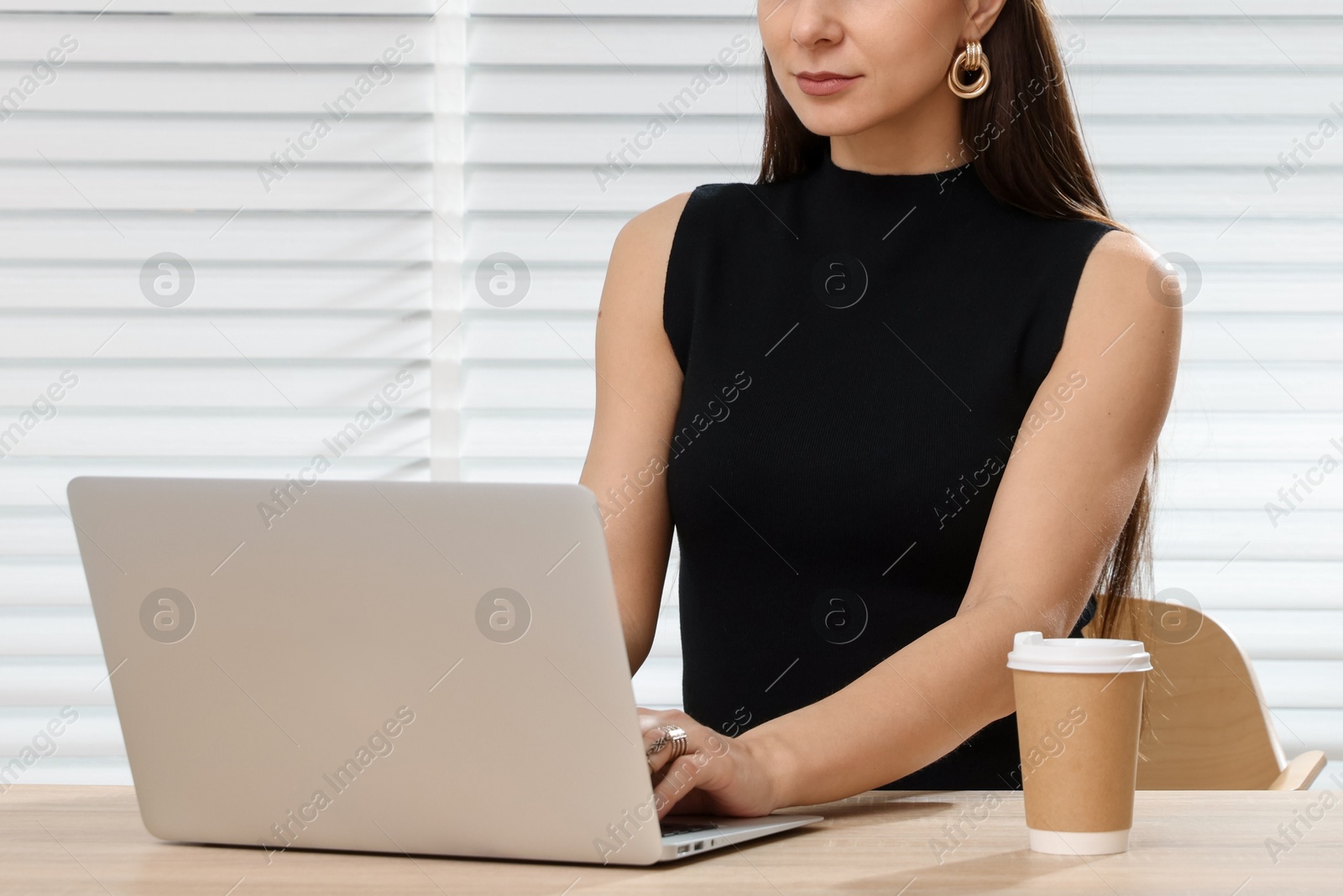 Professional stylist having online consultation with client via laptop at desk indoors, closeup Photo of Professional stylist having online consultation with client via laptop at desk indoors, closeup