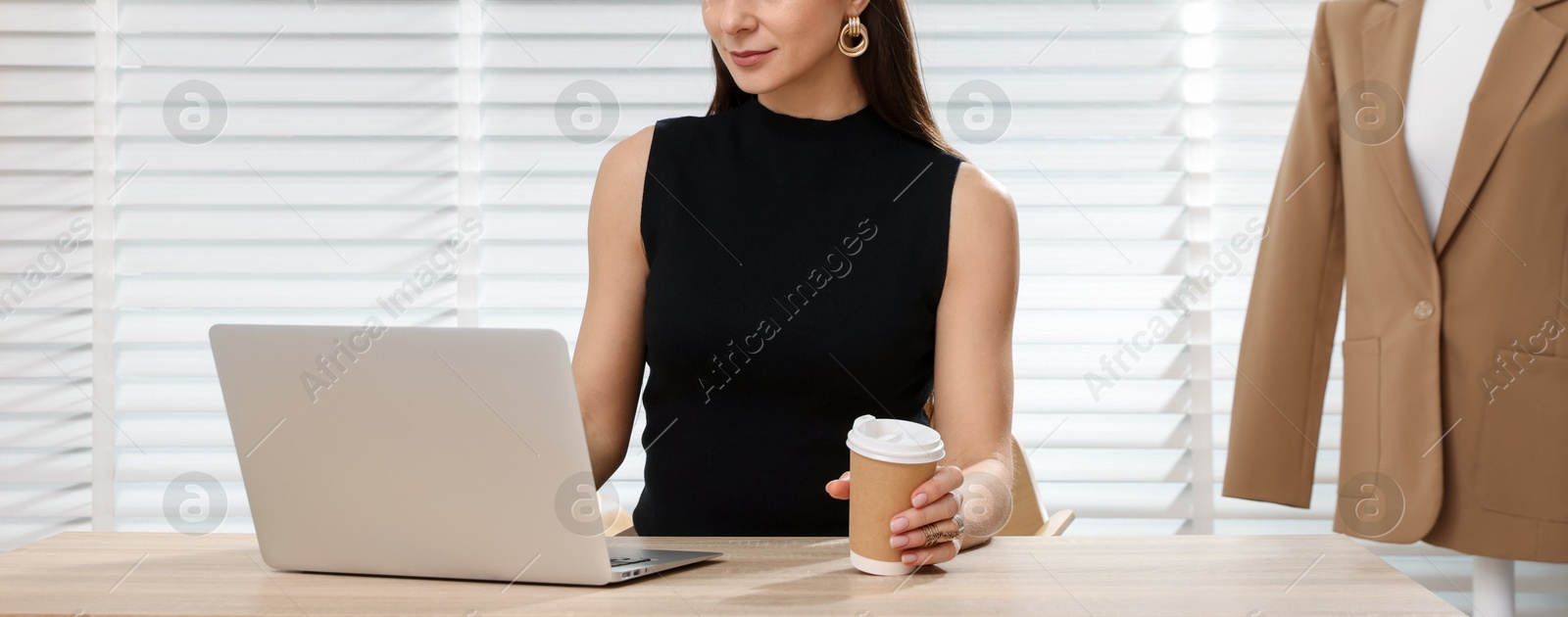 Professional stylist having online consultation with client via laptop at desk indoors Photo of Professional stylist having online consultation with client via laptop at desk indoors