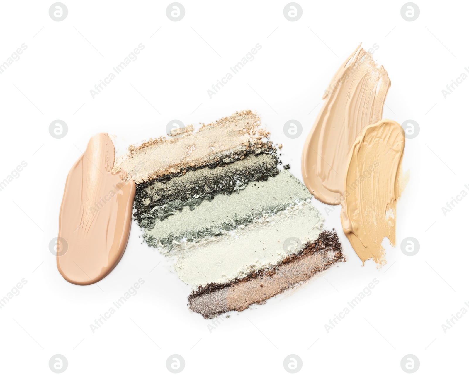 Colorful eyeshadows and foundation on white background, top view Photo of Colorful eyeshadows and foundation on white background, top view