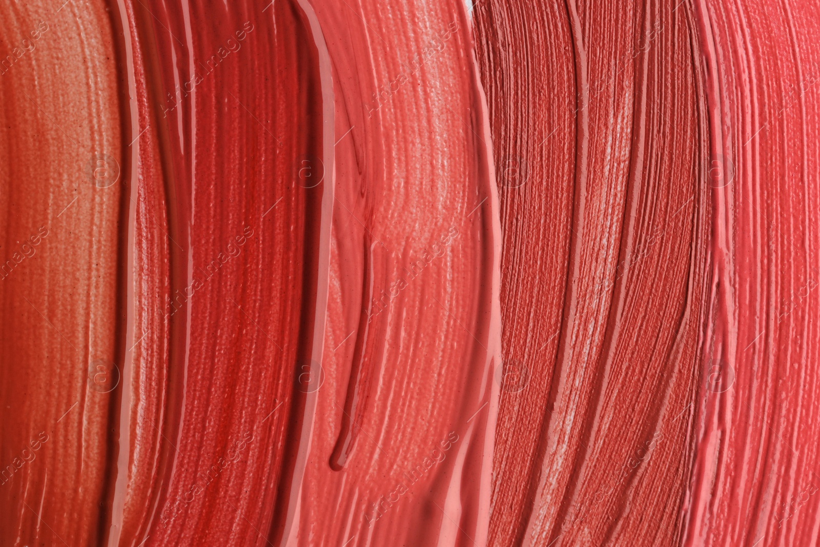 Colorful lip glosses as background, top view Photo of Colorful lip glosses as background, top view