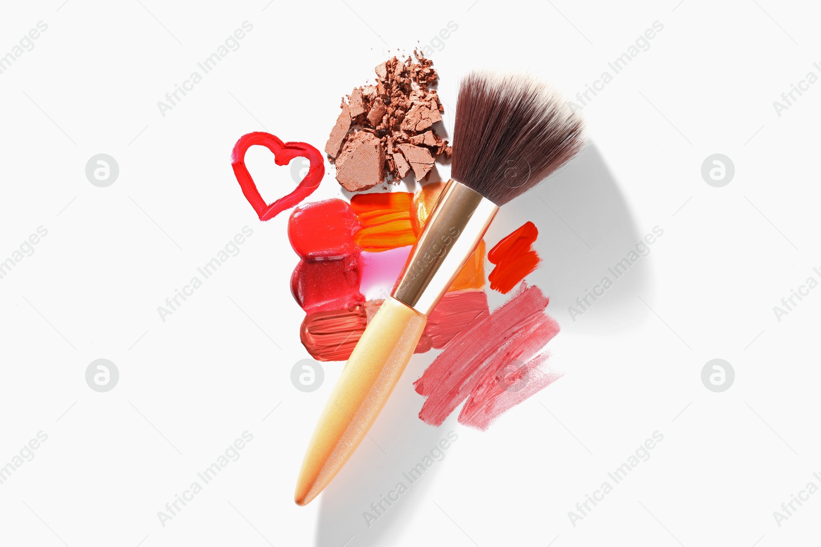 Different cosmetic products and makeup brush on white background, flat lay Photo of Different cosmetic products and makeup brush on white background, flat lay