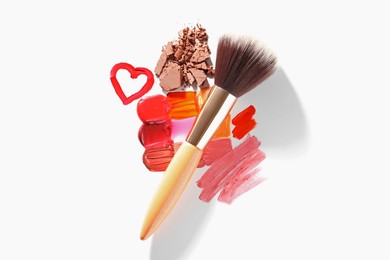 Photo of Different cosmetic products and makeup brush on white background, flat lay