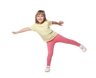 Photo of Happy little girl dancing on white background
