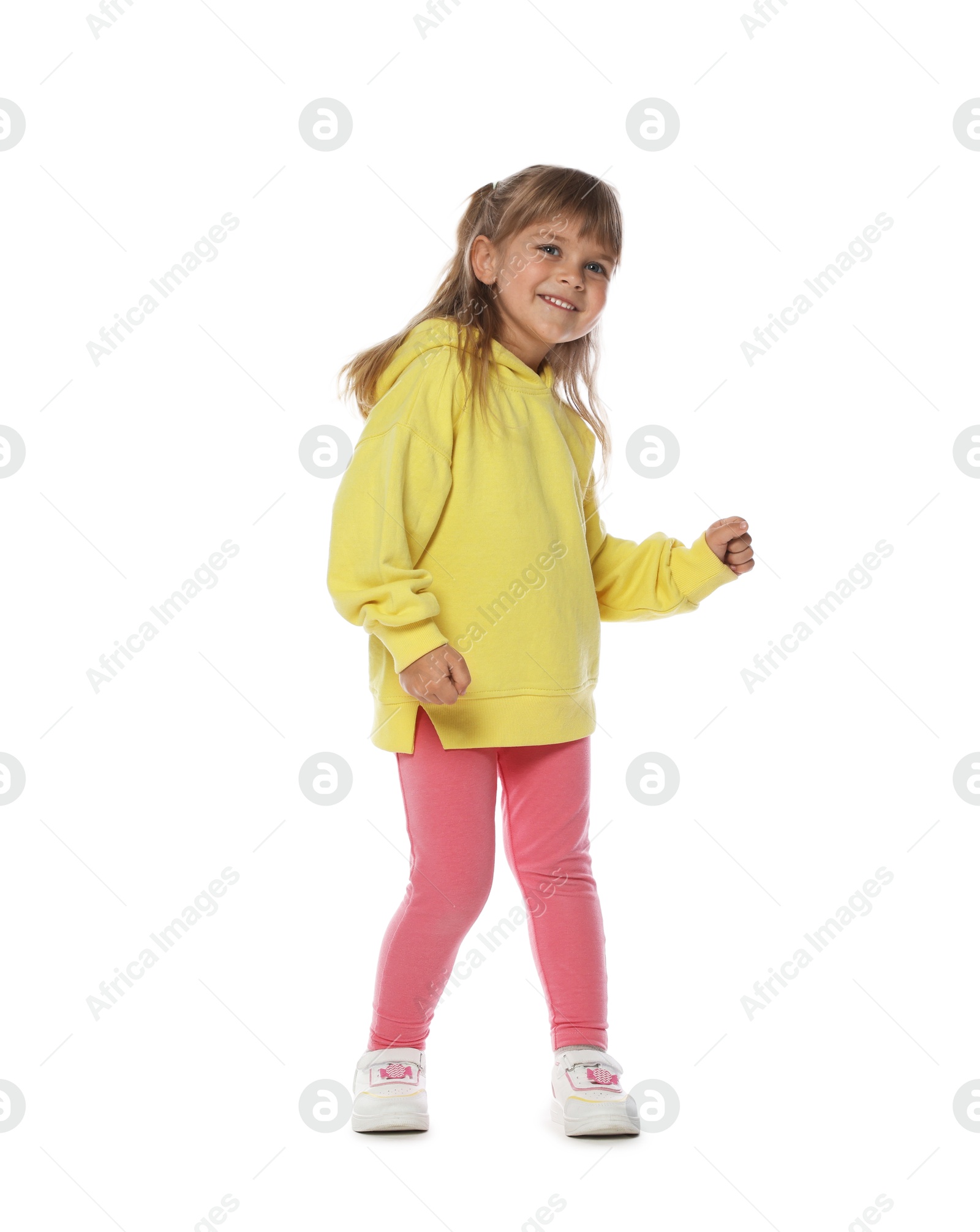 Photo of Happy little girl dancing on white background