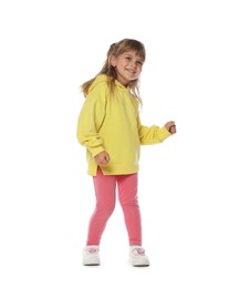 Photo of Happy little girl dancing on white background