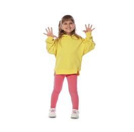 Photo of Happy little girl dancing on white background