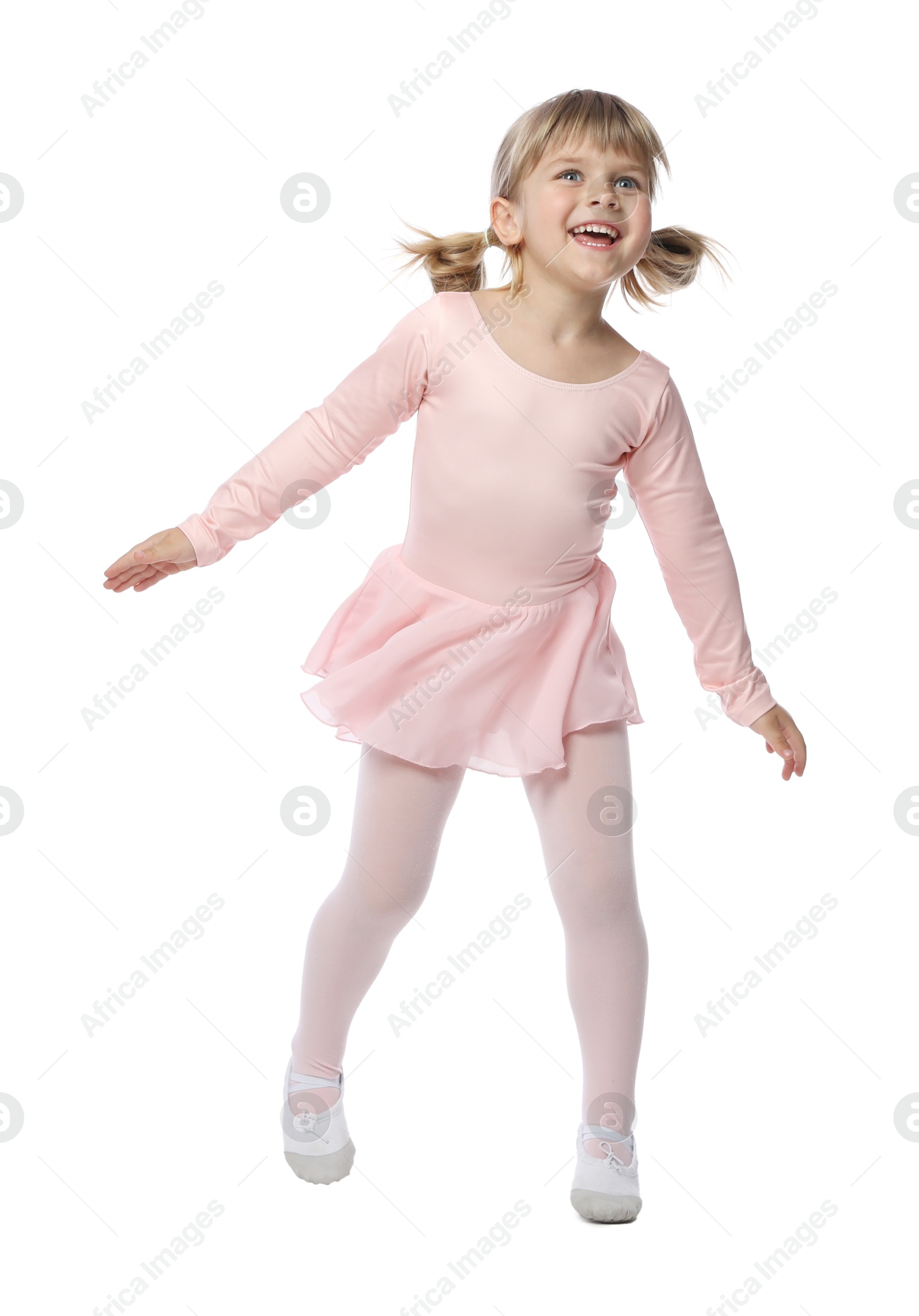 Cute little girl dancing on white background Photo of Cute little girl dancing on white background