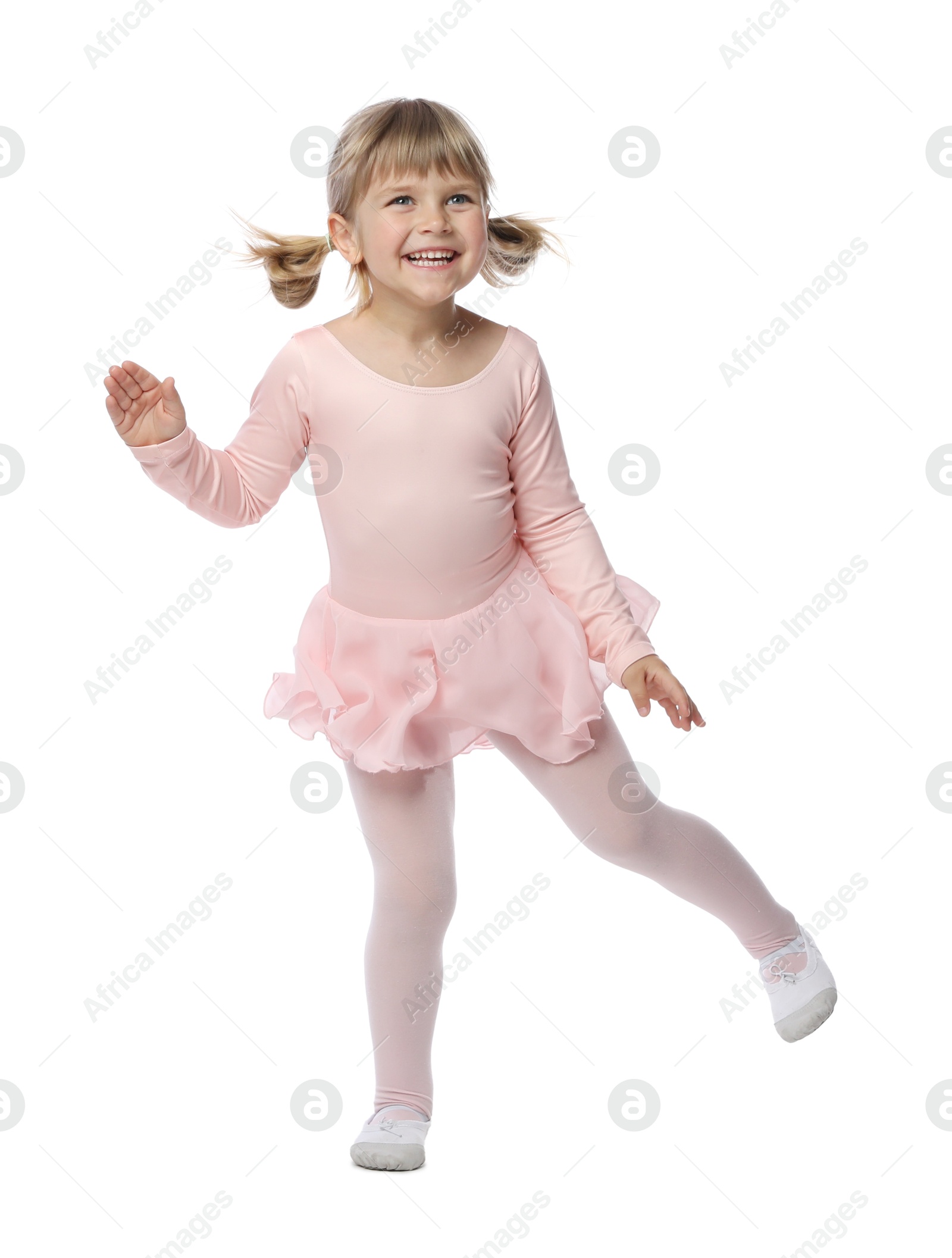 Cute little girl dancing on white background Photo of Cute little girl dancing on white background
