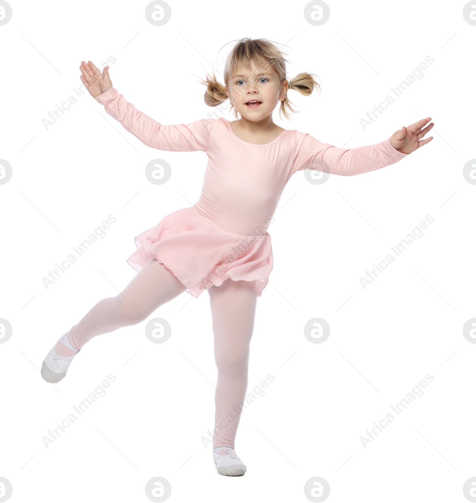 Cute little girl dancing on white background Photo of Cute little girl dancing on white background