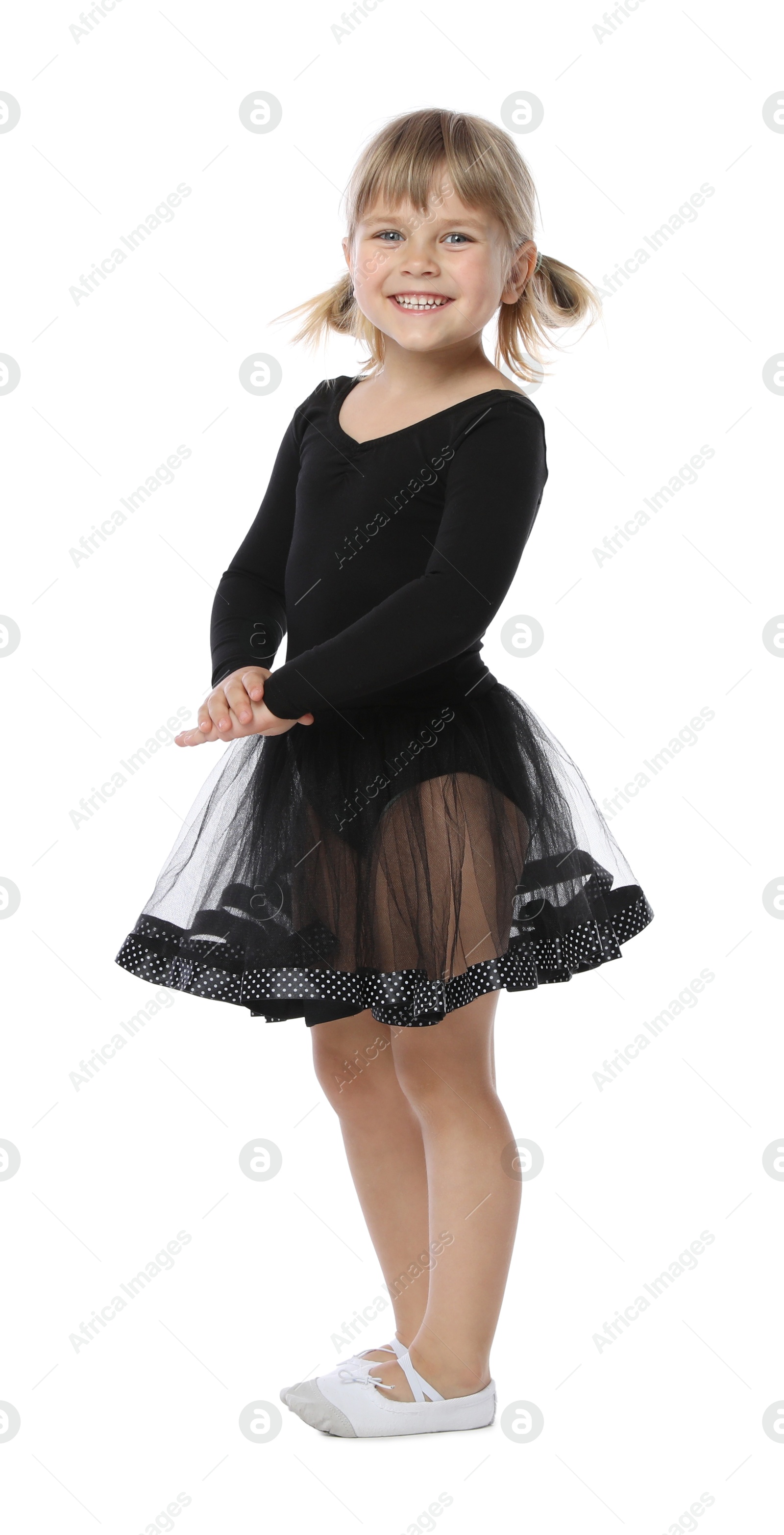 Cute little girl dancing on white background Photo of Cute little girl dancing on white background