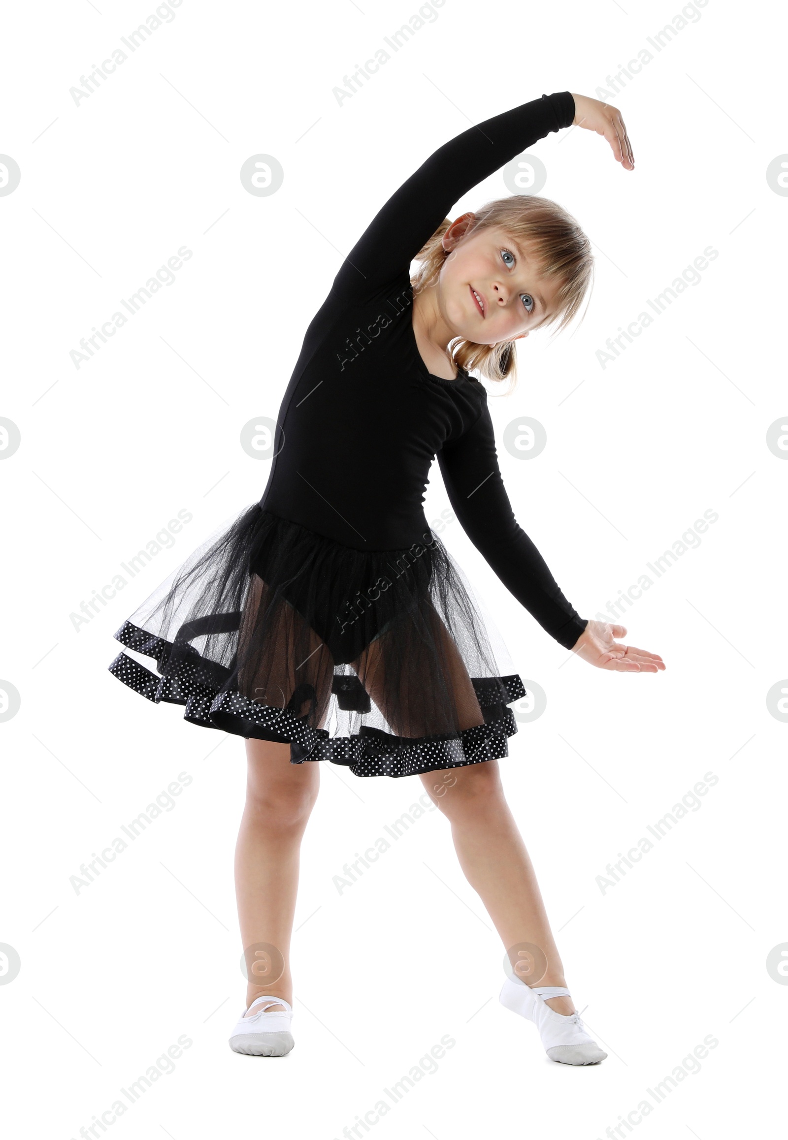 Photo of Cute little girl dancing on white background