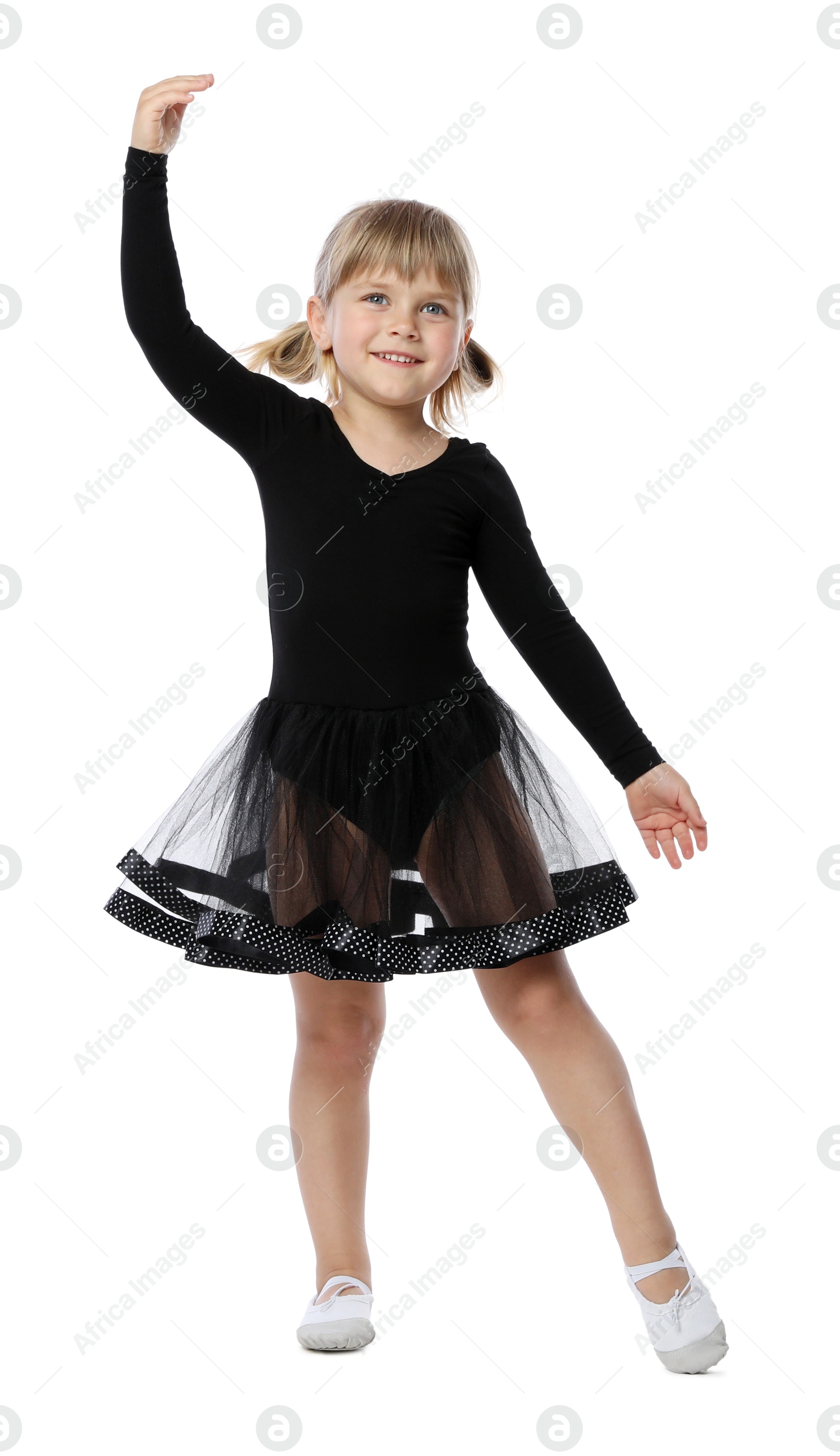 Cute little girl dancing on white background Photo of Cute little girl dancing on white background
