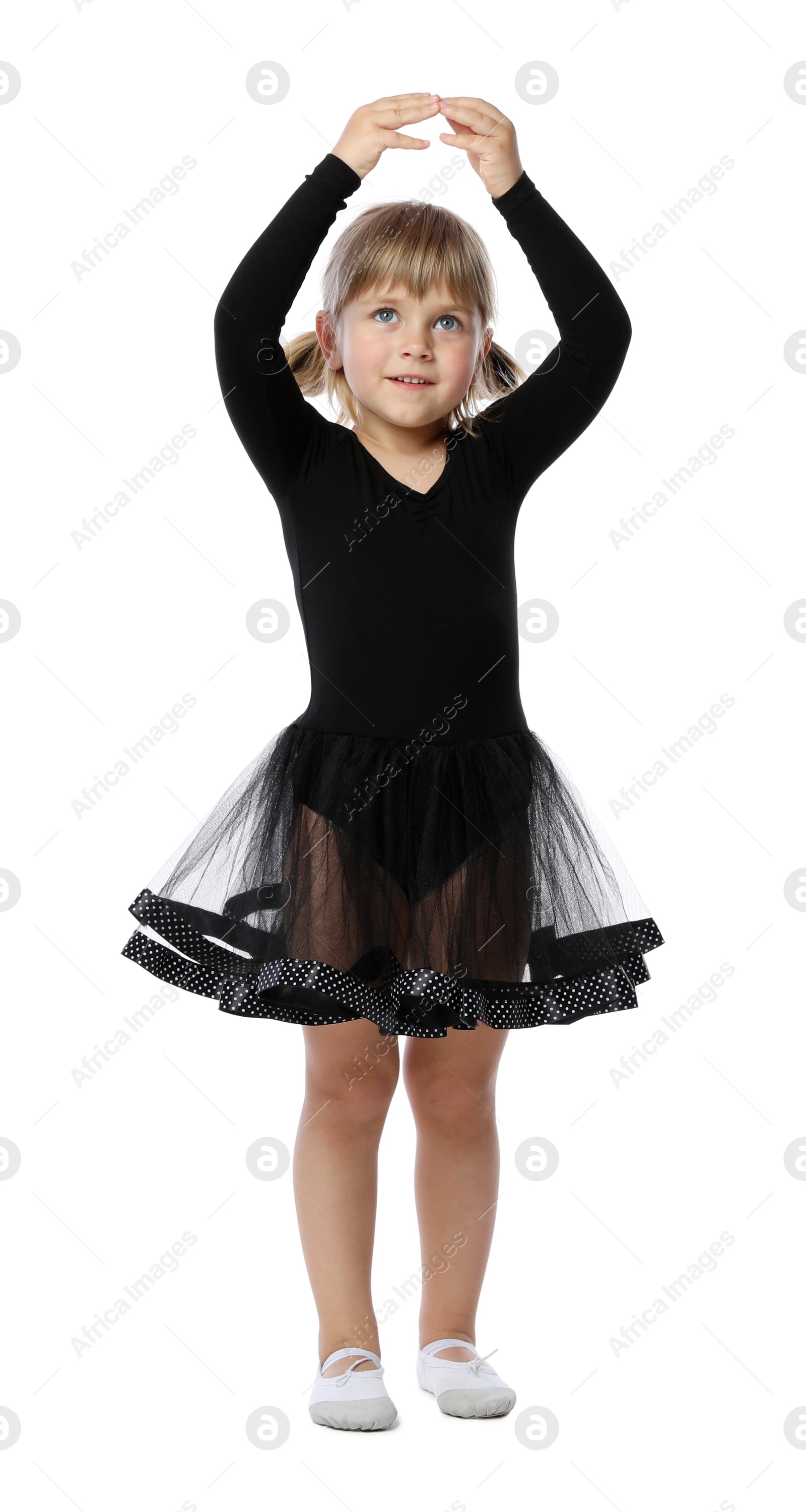 Photo of Cute little girl dancing on white background