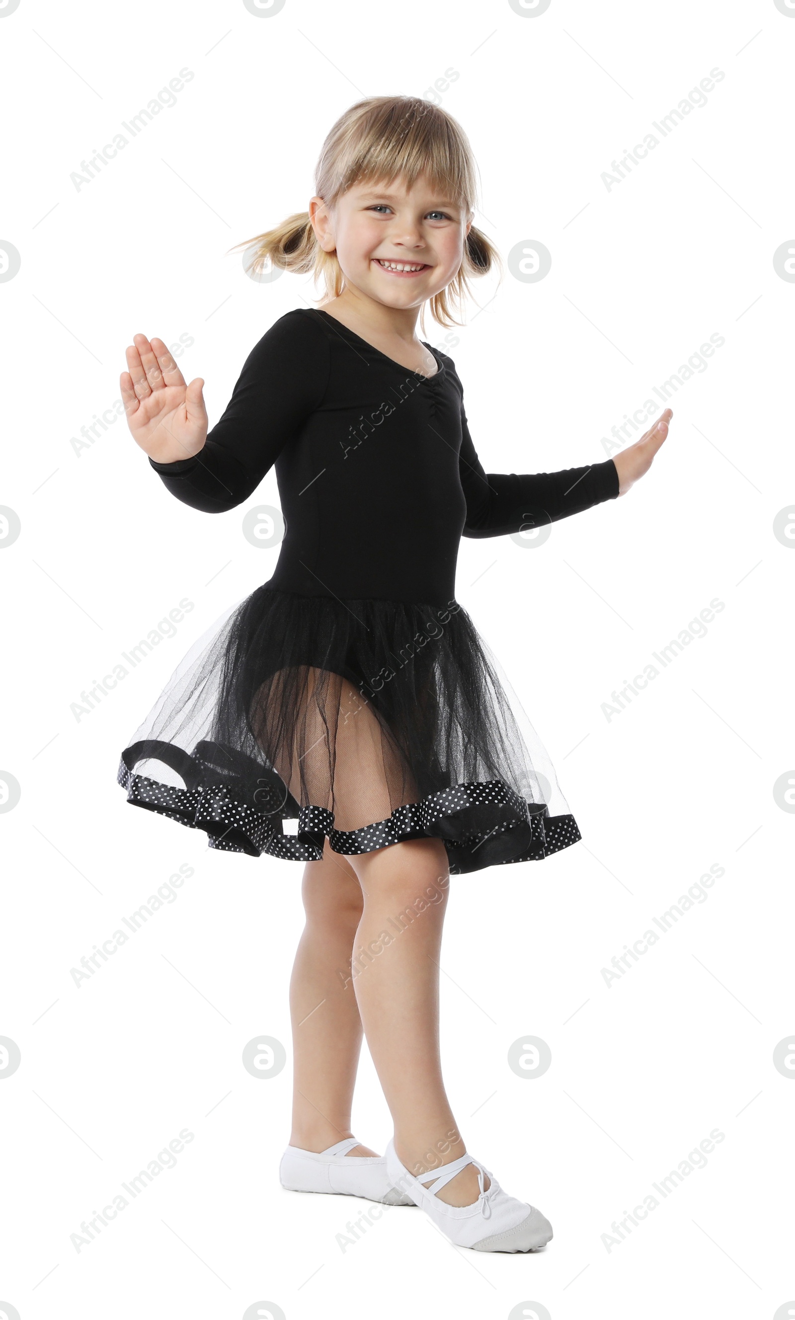 Photo of Cute little girl dancing on white background