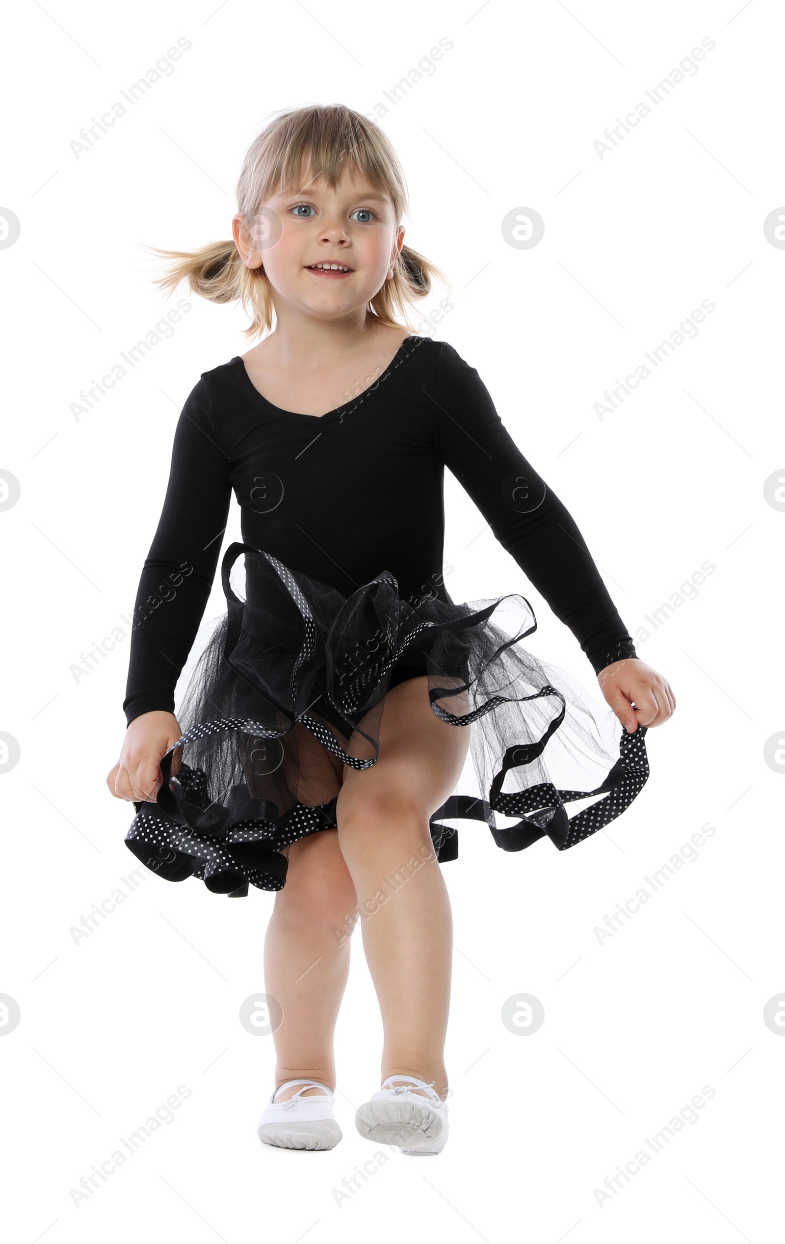 Photo of Cute little girl dancing on white background