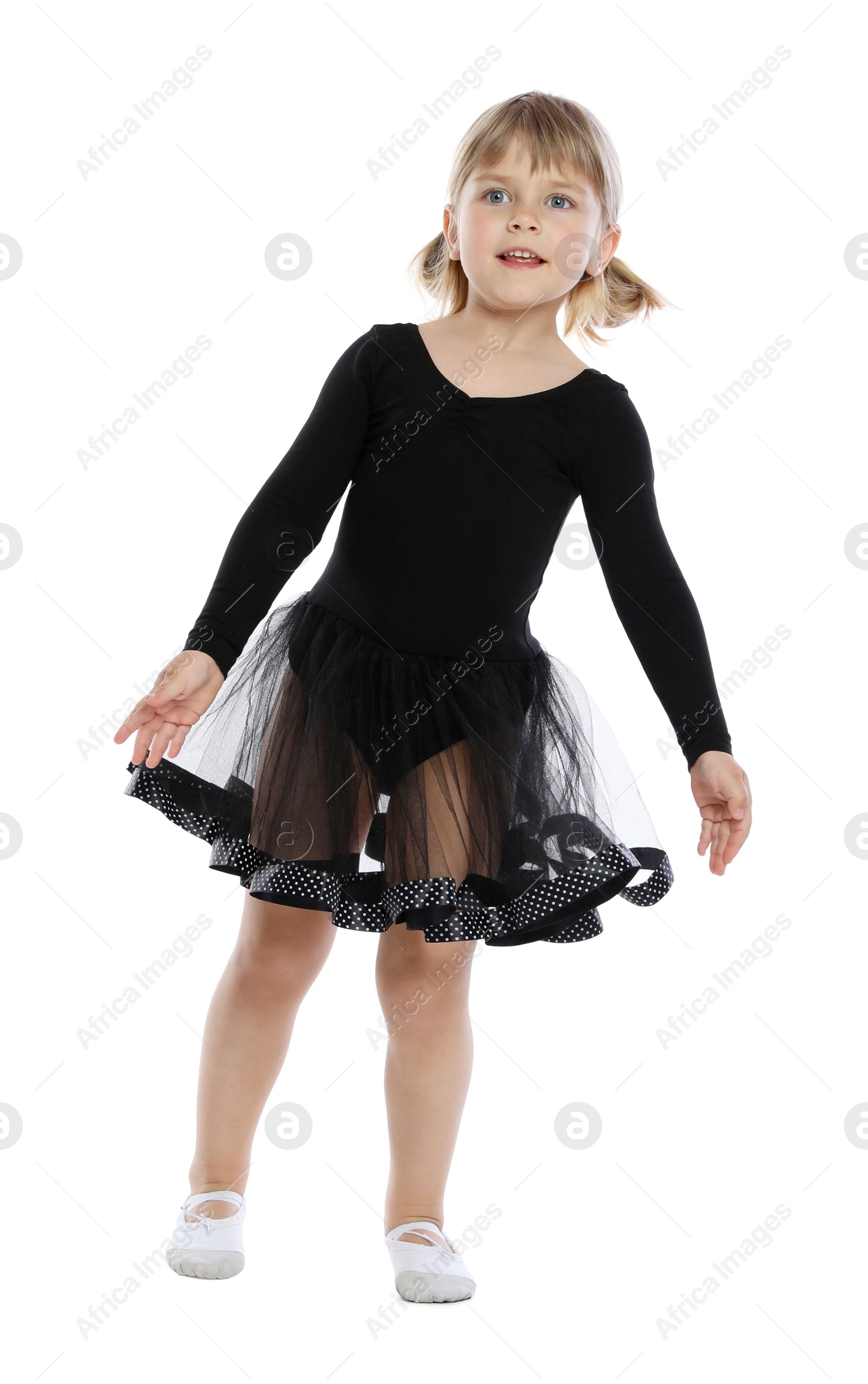 Photo of Cute little girl dancing on white background