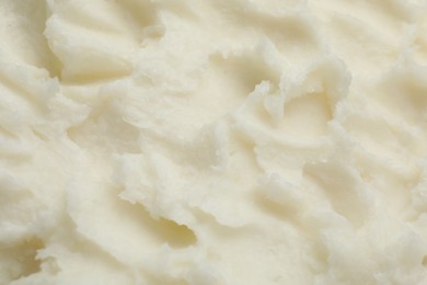Photo of Texture of organic shea butter as background, top view