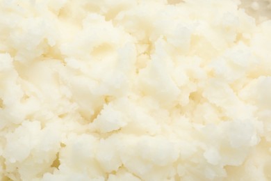 Photo of Texture of organic shea butter as background, top view