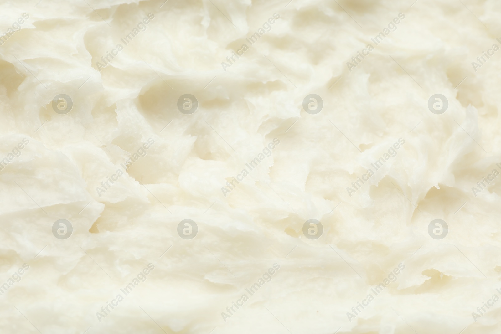 Photo of Texture of organic shea butter as background, top view