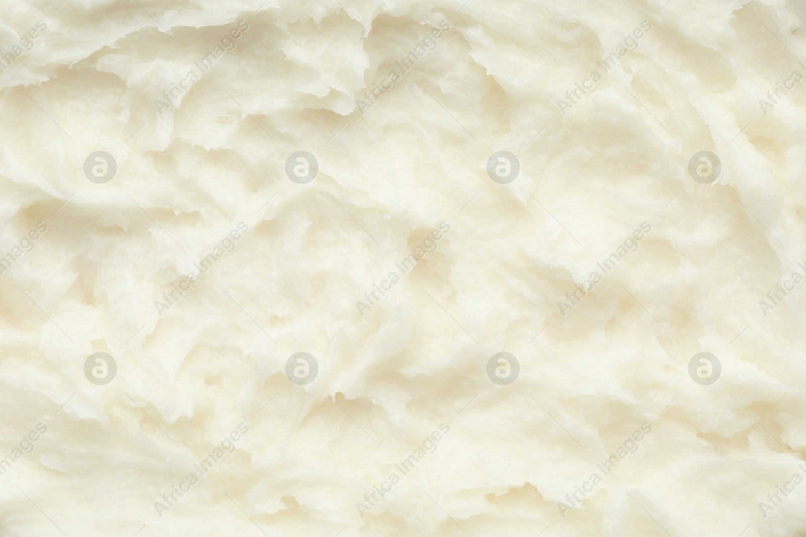 Photo of Texture of organic shea butter as background, top view