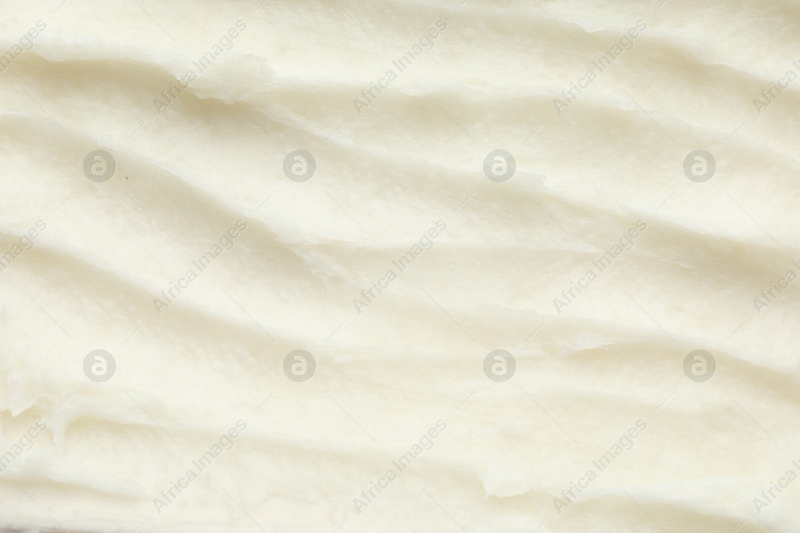 Photo of Texture of organic shea butter as background, top view