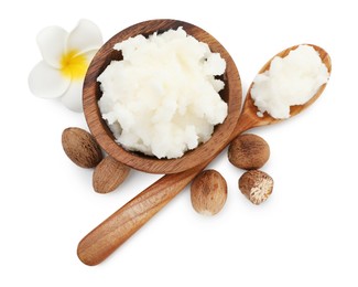 Photo of Shea butter in bowl, spoon, nuts and flower isolated on white, top view