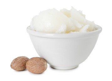 Photo of Shea butter in bowl and nuts isolated on white