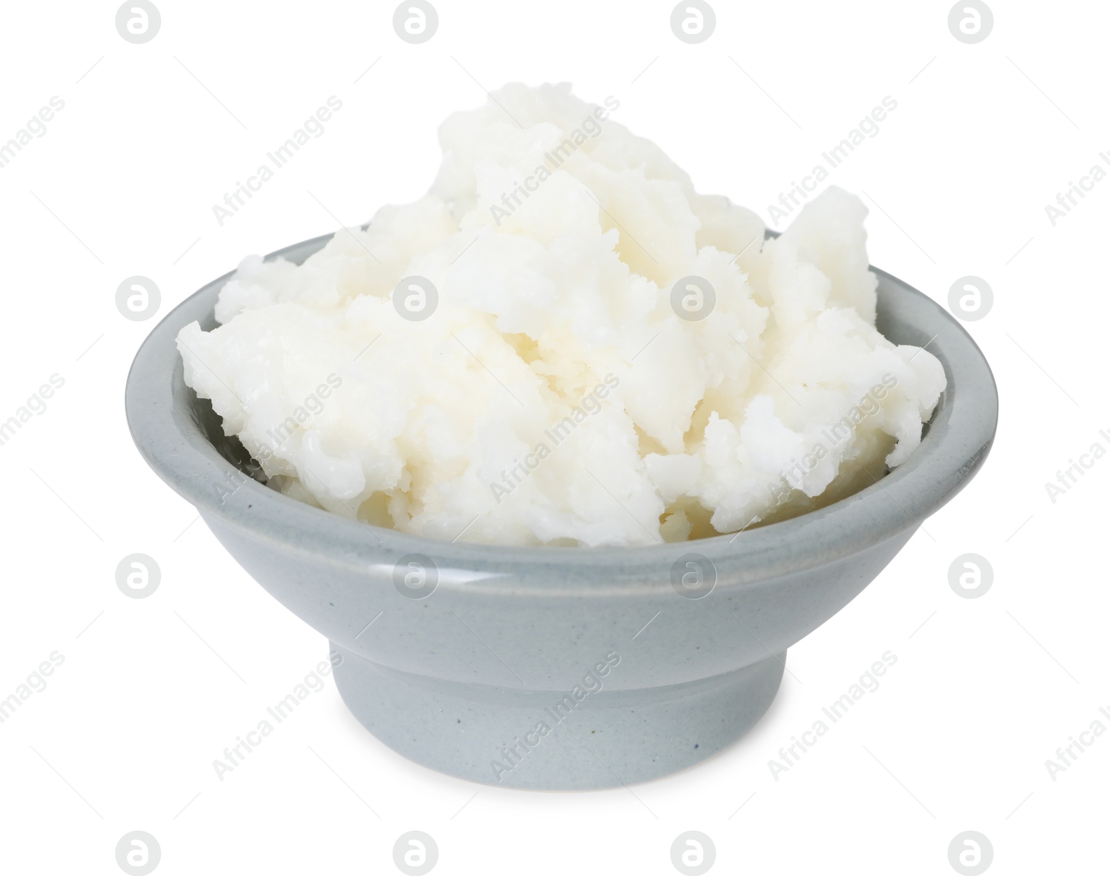 Photo of Shea butter in bowl isolated on white
