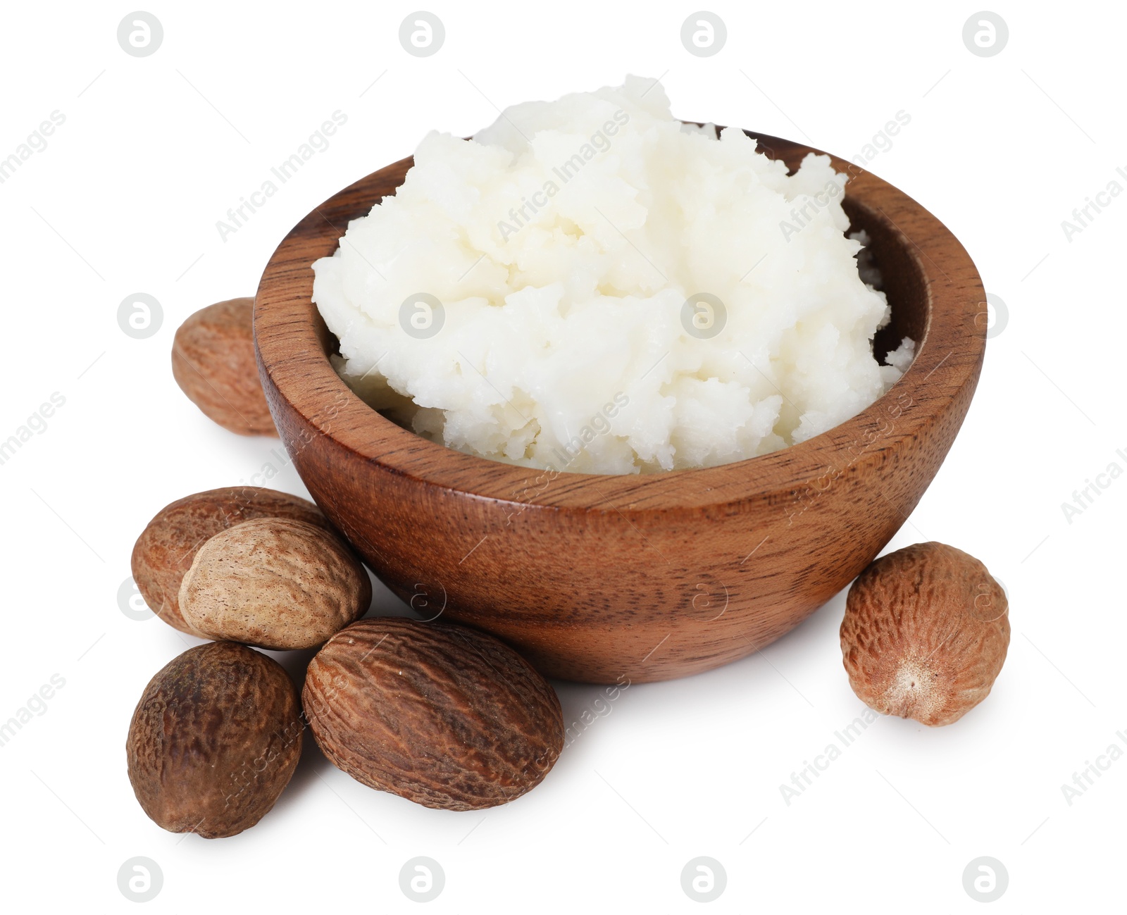 Shea butter in bowl and nuts isolated on white Photo of Shea butter in bowl and nuts isolated on white